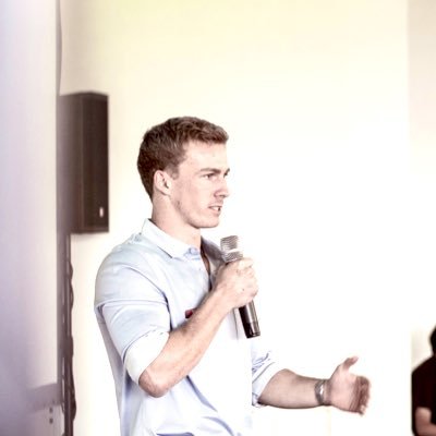 Rylan Loader speaking on stage